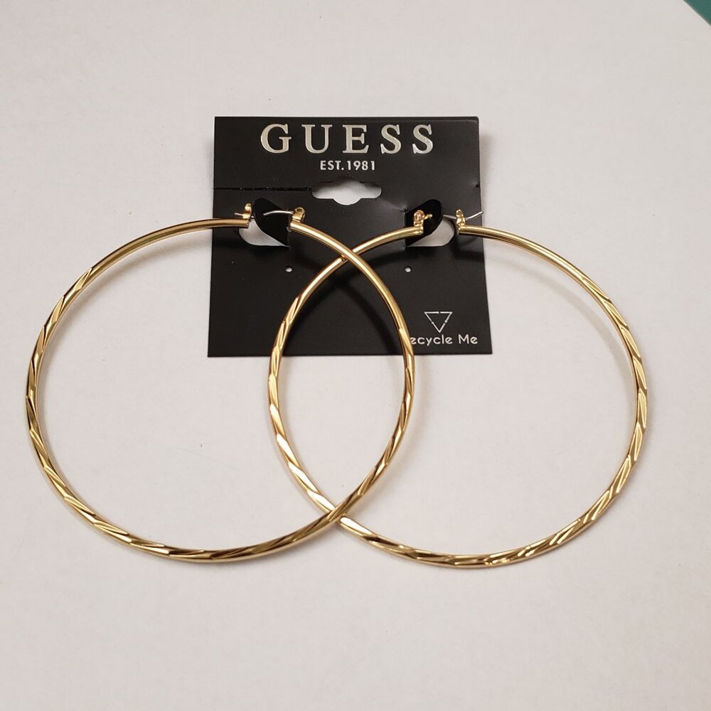Guess, NWT, large gold tone twisted diamond cut style hoop earrings, pierced